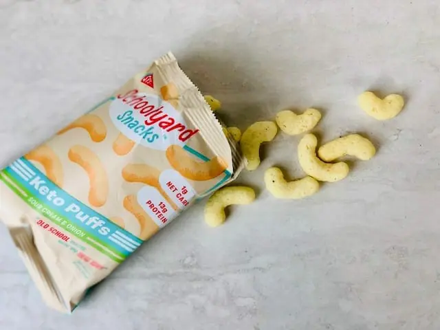 schoolyard-snacks-sour-cream-keto-cheese-puffs-bag-open- schoolyard snacks reviews-mealfinds